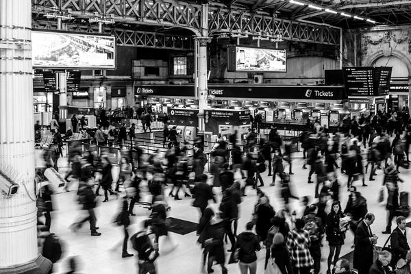 grayscale photography of people walking in train station 735795